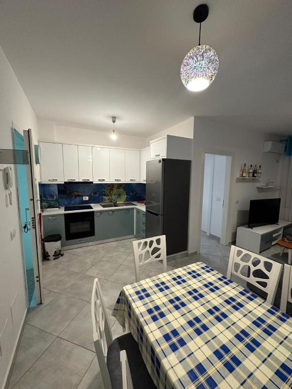 Kuchyň nebo kuchyňský kout v ubytování Apartments Shengjin Berti