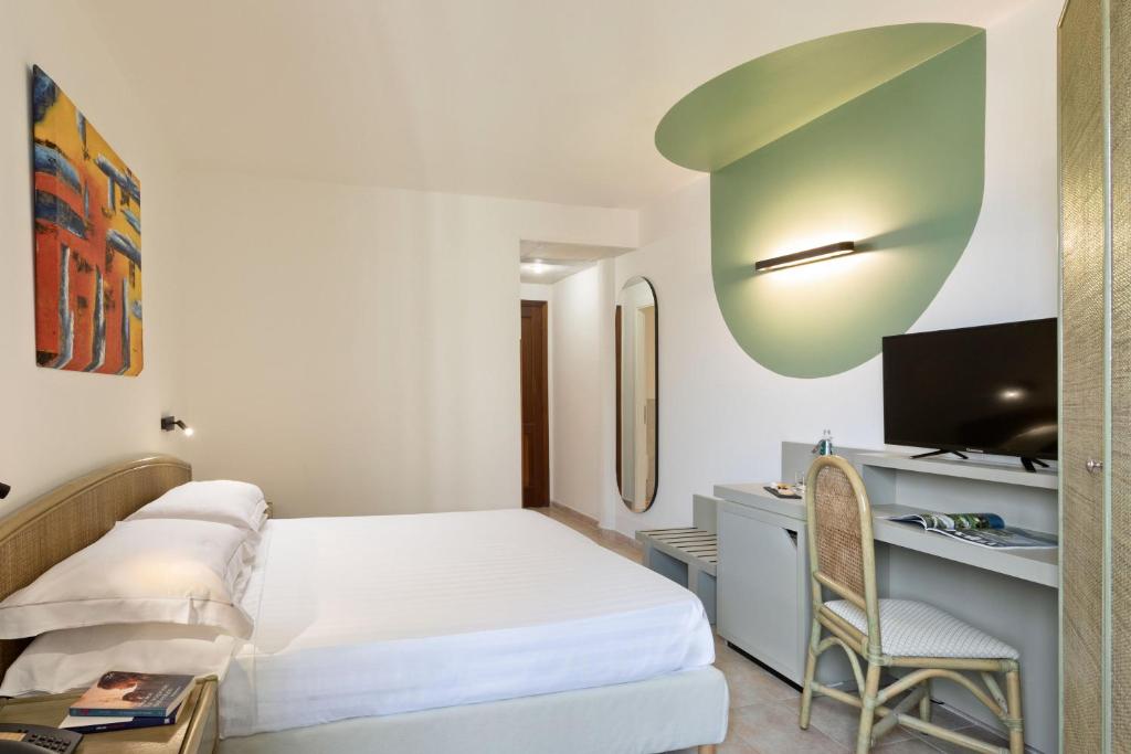 Postel nebo postele na pokoji v ubytování Rina Hotel