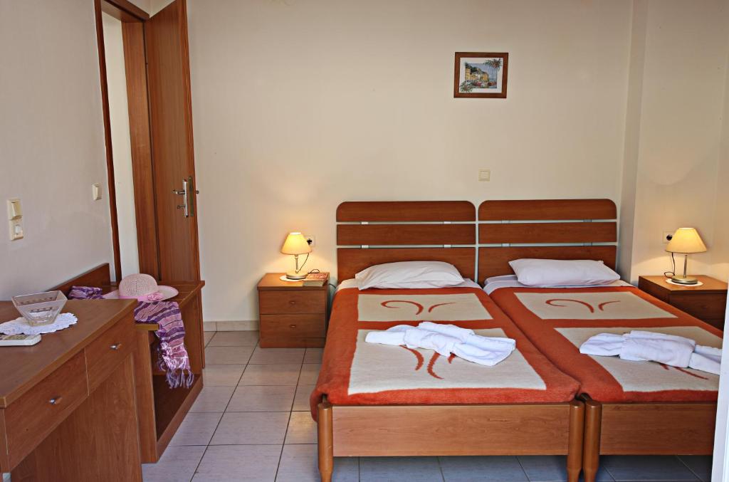 Postel nebo postele na pokoji v ubytování Elena-Pelagia Villas
