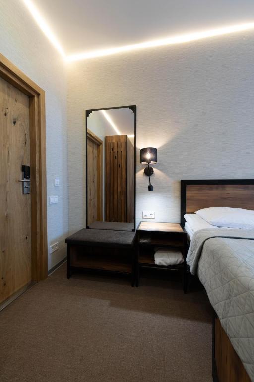Postel nebo postele na pokoji v ubytování MISTO capsule hotel
