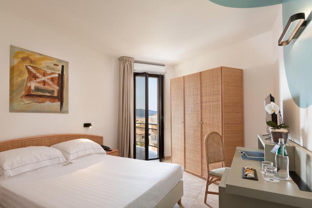 Postel nebo postele na pokoji v ubytování Rina Hotel