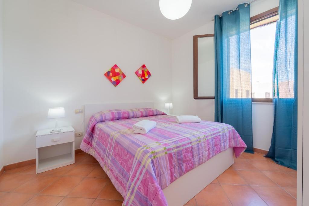 Postel nebo postele na pokoji v ubytování Residence Favonio