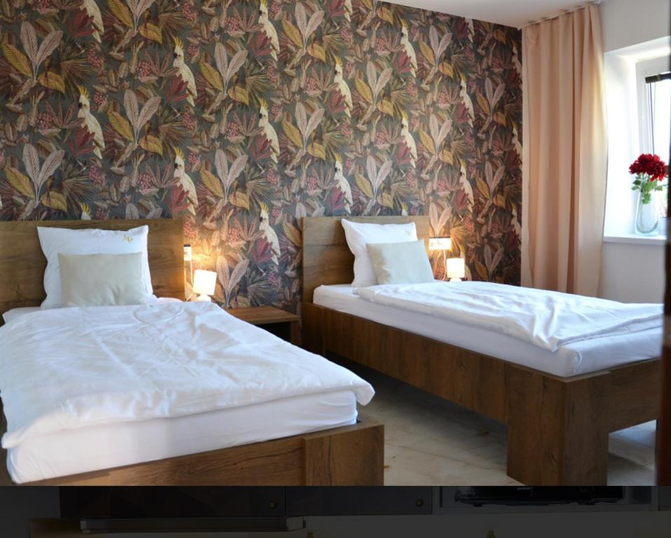 Postel nebo postele na pokoji v ubytování Apartmany u Polanských Lednice