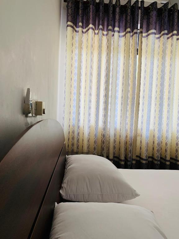 Postel nebo postele na pokoji v ubytování Hotel Ameliya