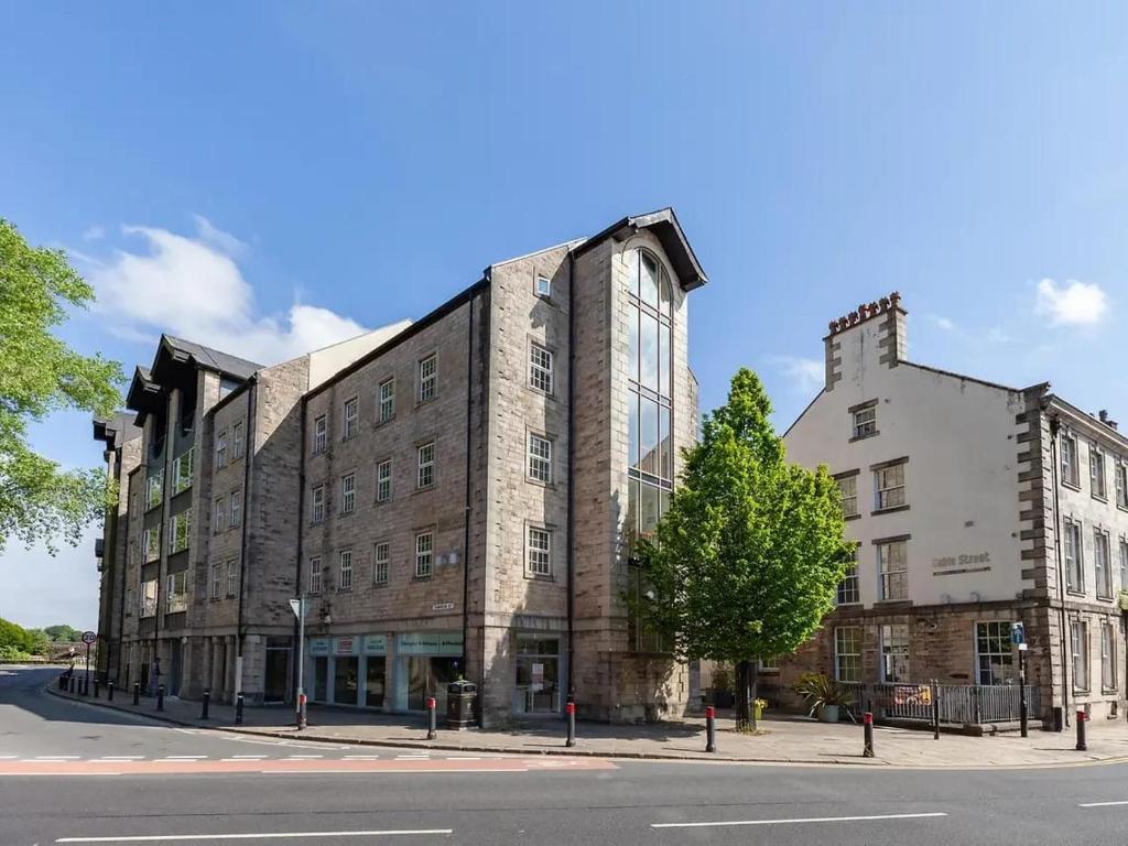 a large brick building on the corner of a street at For Student Only - Cable Street 10 Min Walk to Lancaster Station in Lancaster