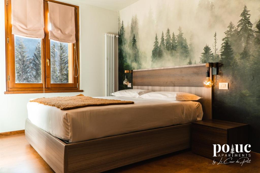 Postel nebo postele na pokoji v ubytování Maison del Bosco - Poluc Apartments bilocale