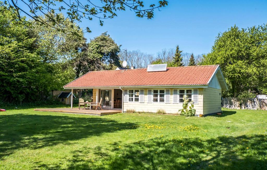 a small white house with a red roof at 3 Bedroom Lovely Home In Nykøbing Sj in Klint