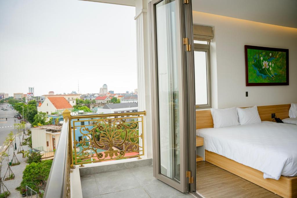 Postel nebo postele na pokoji v ubytování Min Min Hotel