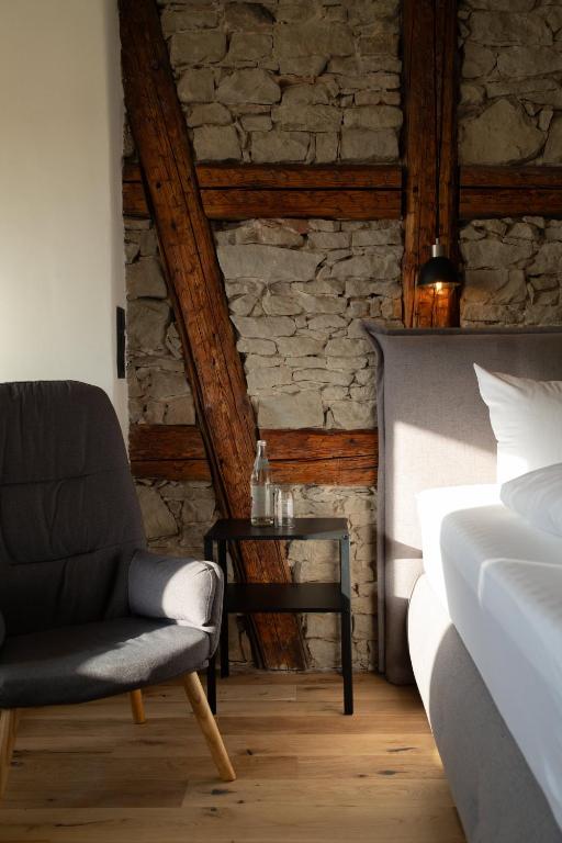 Postel nebo postele na pokoji v ubytování Lehm & Stil - Wohnen in nachhaltiger Atmosphäre