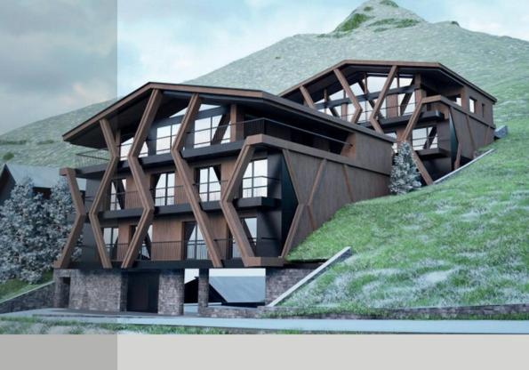 una casa en la cima de una colina con césped en Aurum, en Ischgl