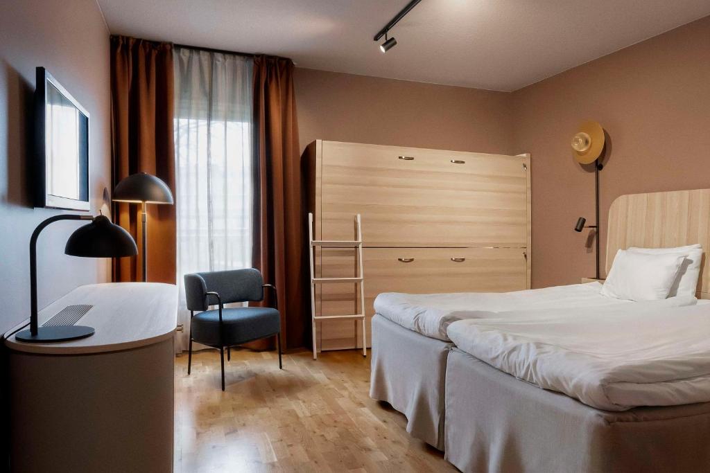 Postel nebo postele na pokoji v ubytování Scandic Visby