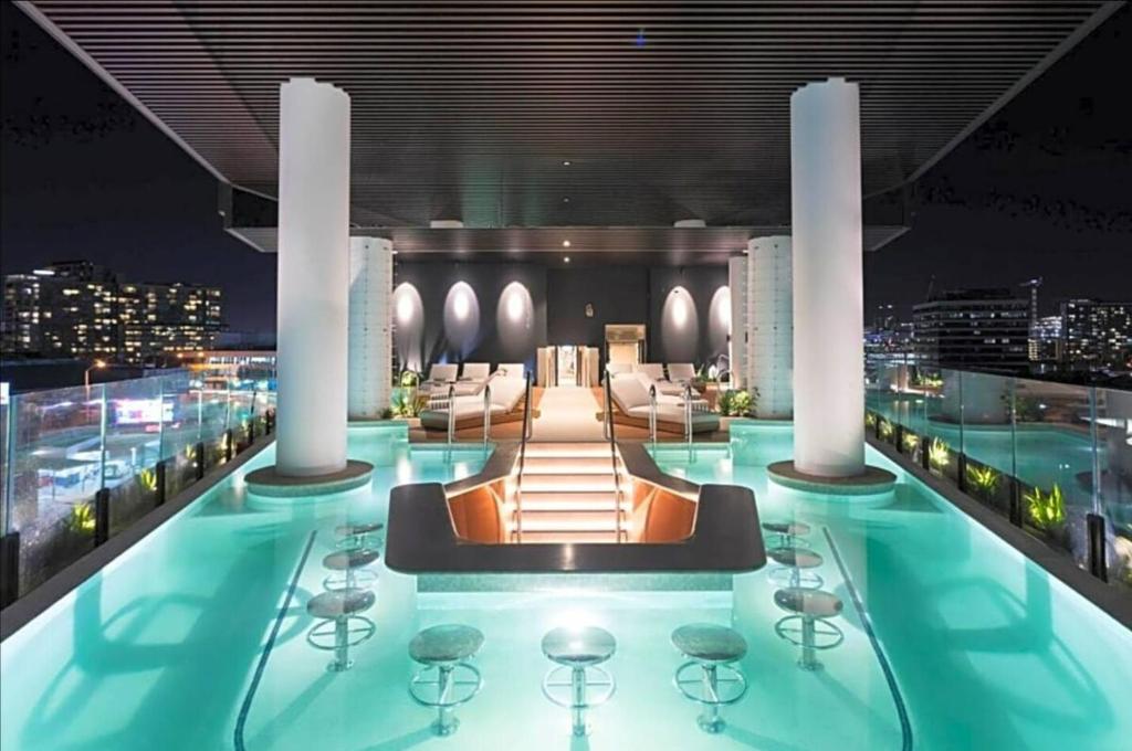 a swimming pool on the top of a building at FV PEPPERS Luxury City Apartment in Brisbane