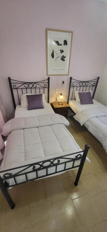 A bed or beds in a room at Margarita rooms