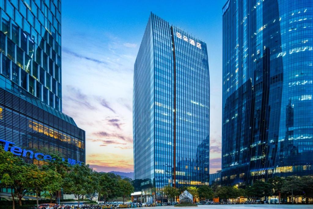 a group of tall buildings in a city at Atour Hotel Shenzhen Nanshan Mango Building in Shenzhen