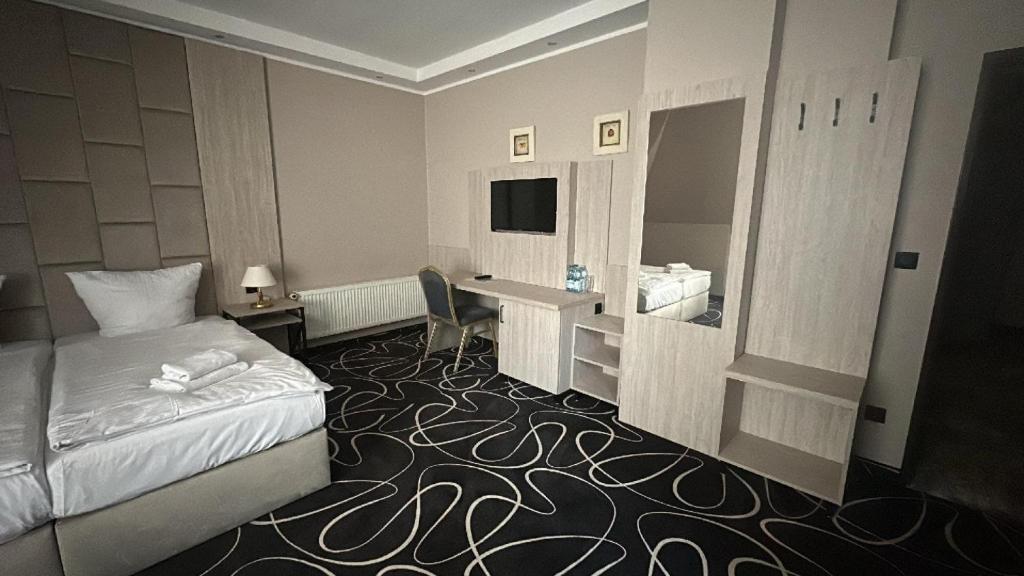 TV a/nebo společenská místnost v ubytování Trofana Wellness & SPA