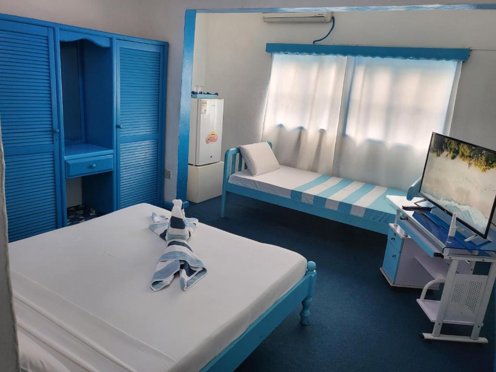 Postel nebo postele na pokoji v ubytování Le Chateau Bleu