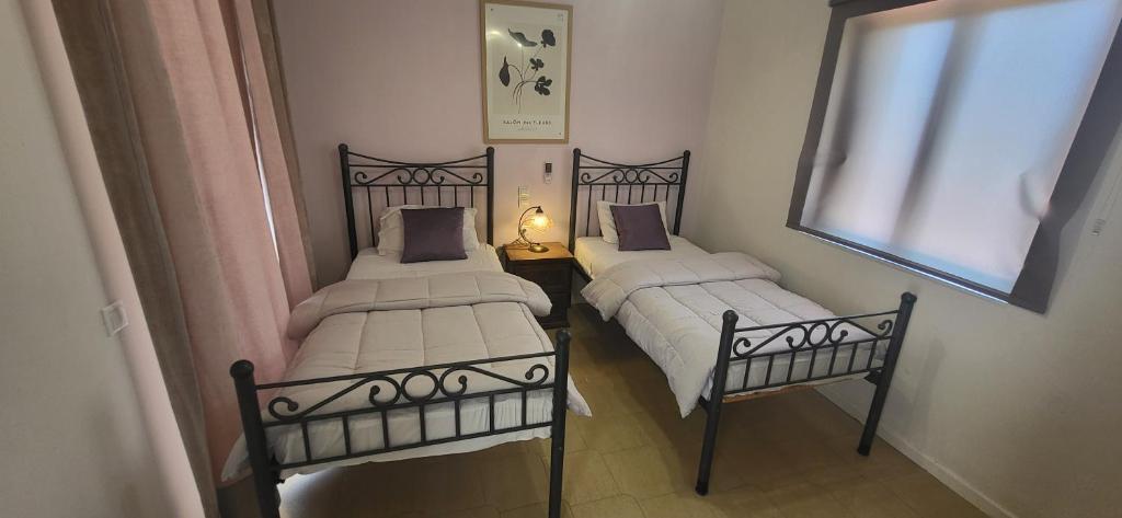 A bed or beds in a room at Margarita rooms