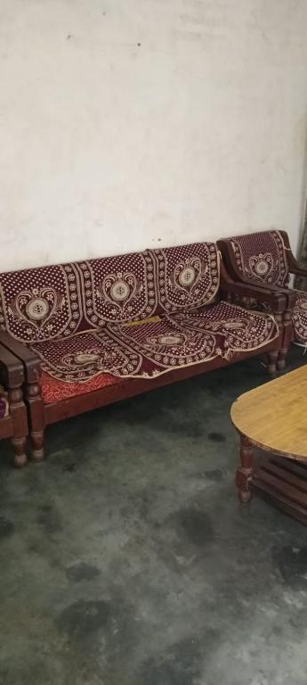 a couch sitting in a room with a table at Dinesh kumar in Jāmb