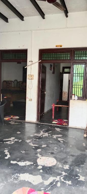 an empty room with an open door and a room with a floor at Dinesh kumar in Jāmb