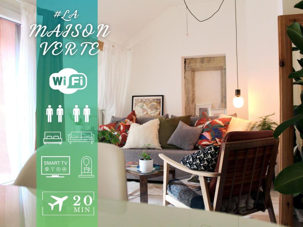 a living room with a couch and a table at #LaMaisonVerte-calme en zone piétonne de Mulhouse in Mulhouse