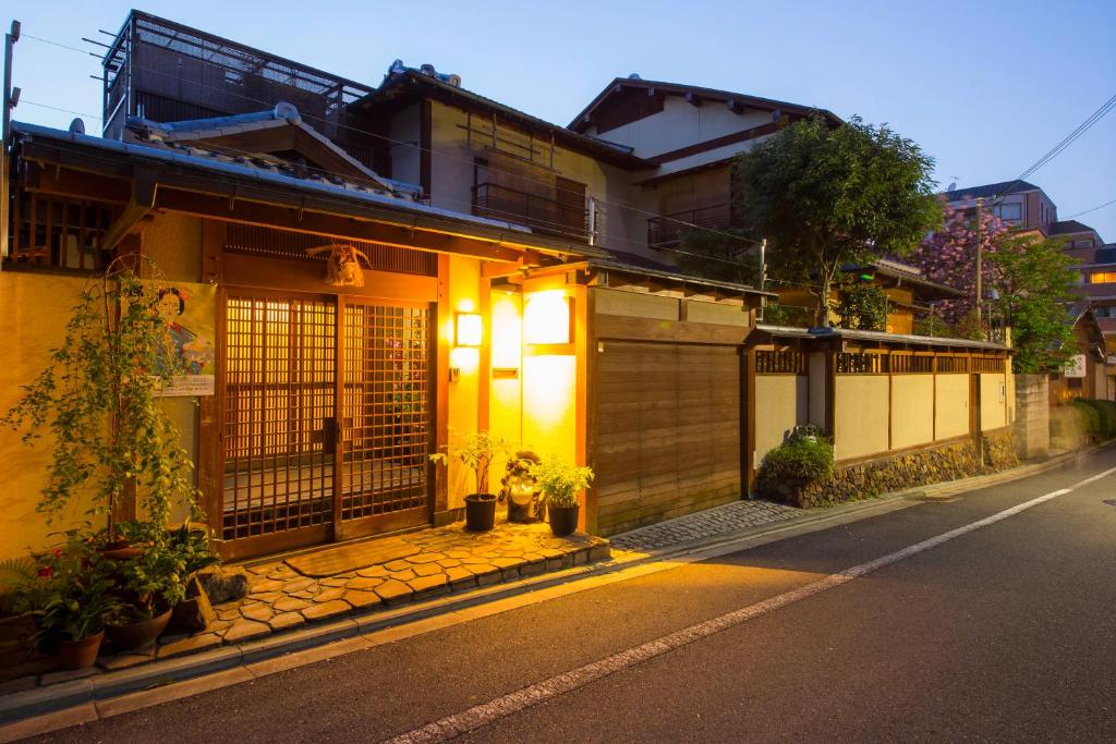 a building with lights on the side of a street at Kamuroan in Kyoto