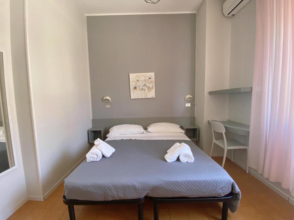 Postel nebo postele na pokoji v ubytování Hotel Residence Ponente