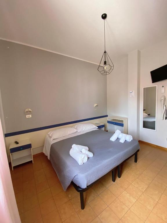 Postel nebo postele na pokoji v ubytování Hotel Residence Ponente