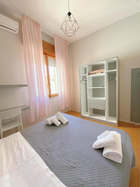 Postel nebo postele na pokoji v ubytování Hotel Residence Ponente