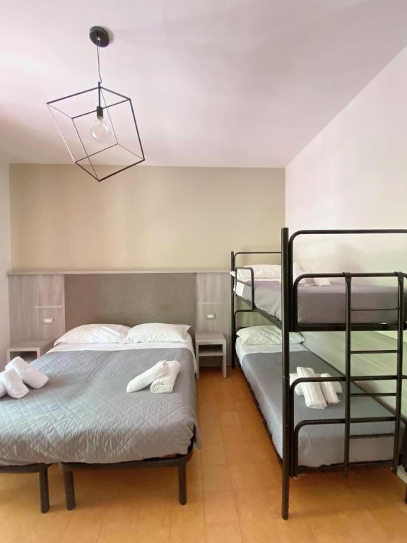Postel nebo postele na pokoji v ubytování Hotel Residence Ponente