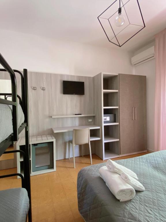 Postel nebo postele na pokoji v ubytování Hotel Residence Ponente