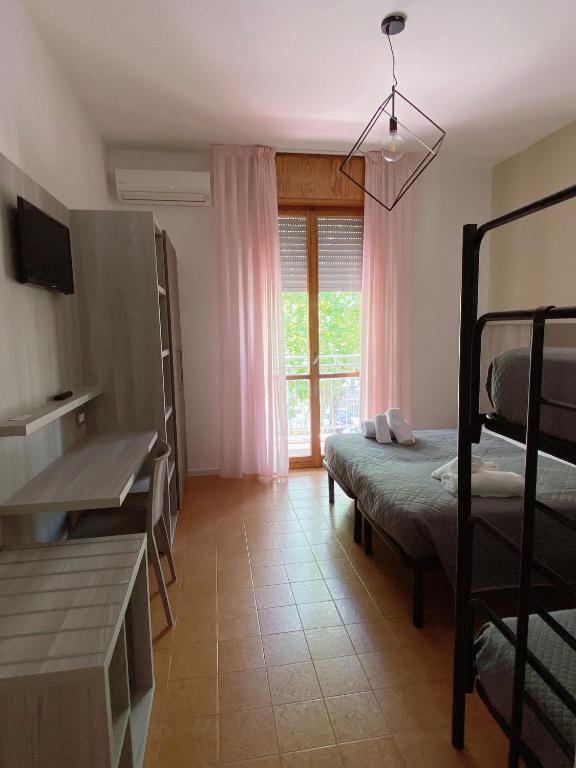 Postel nebo postele na pokoji v ubytování Hotel Residence Ponente