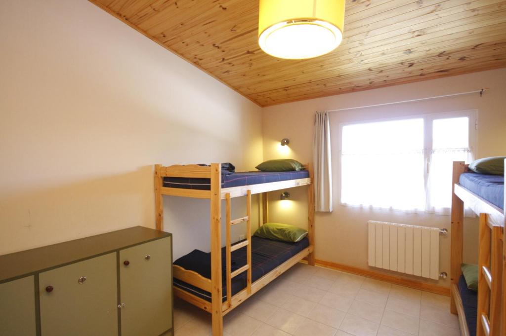 Postel nebo postele na pokoji v ubytování El Gualicho Hostel