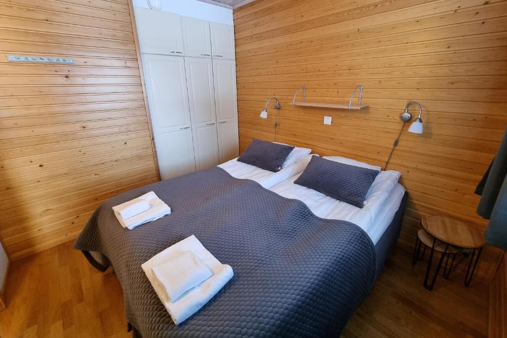 Кровать или кровати в номере Kuukkeli Apartments Suite