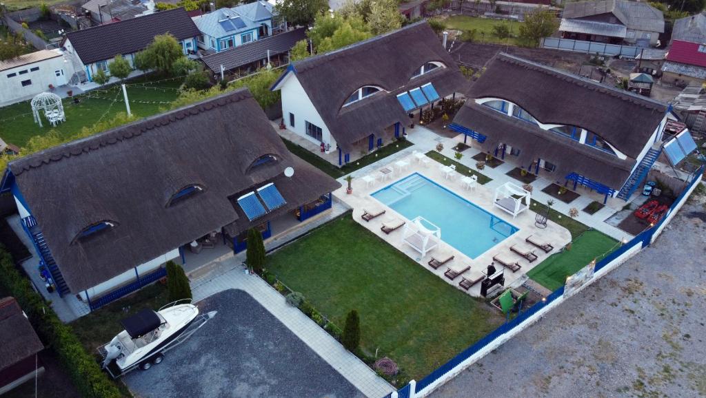 an aerial view of a house with a swimming pool at Complex Turistic Casa Anastasia in Murighiol