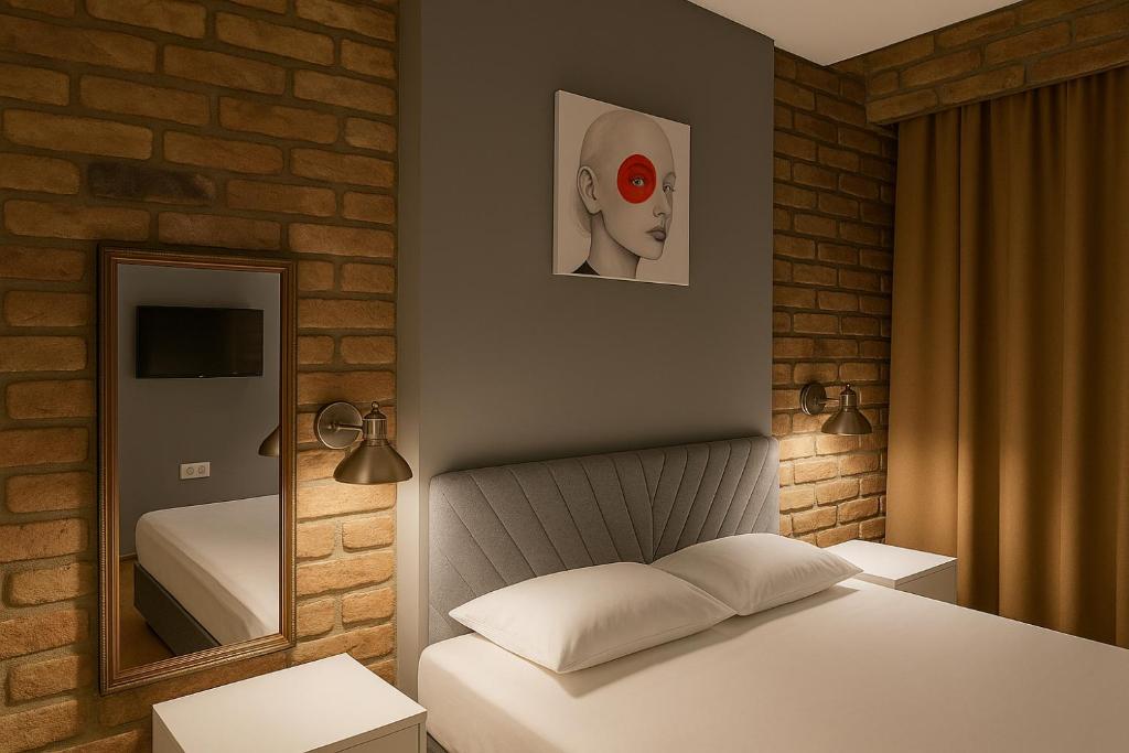 Postel nebo postele na pokoji v ubytování Utarit Hotel