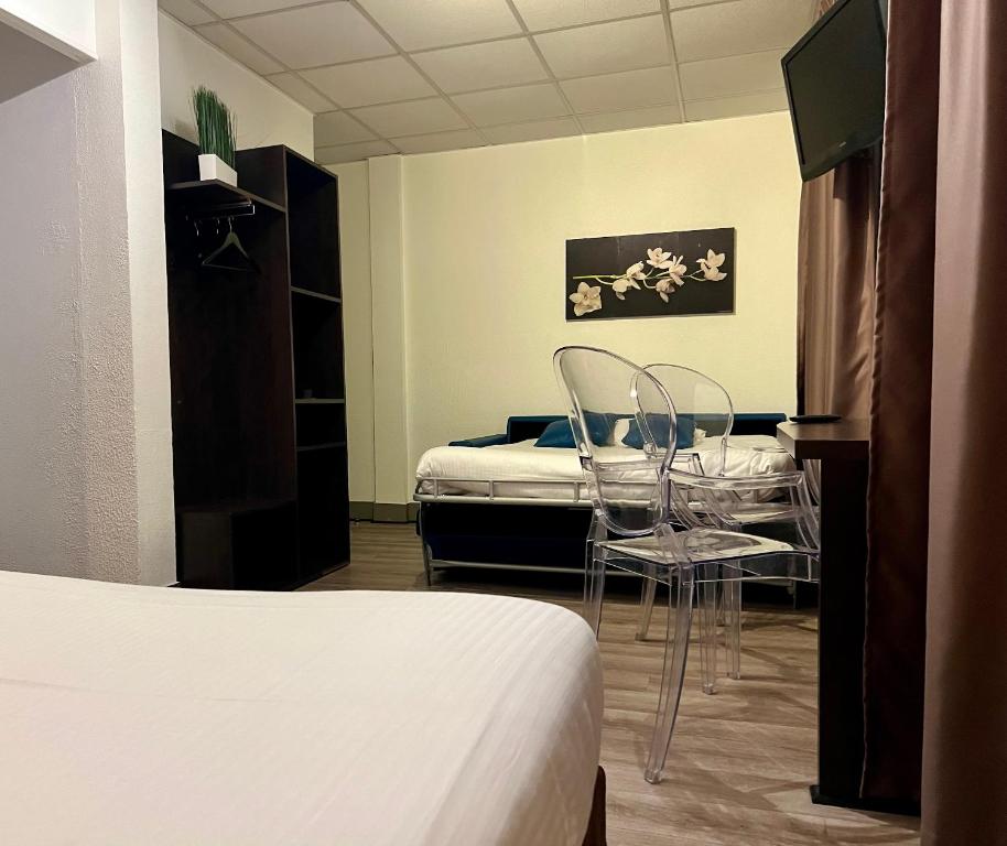 Postel nebo postele na pokoji v ubytování Hôtel Vol de Nuit Purpan