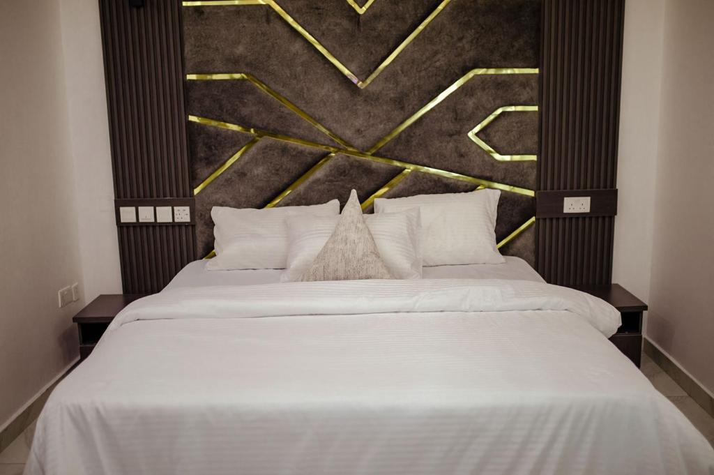 Postel nebo postele na pokoji v ubytování Hilton Euphoria Hotel