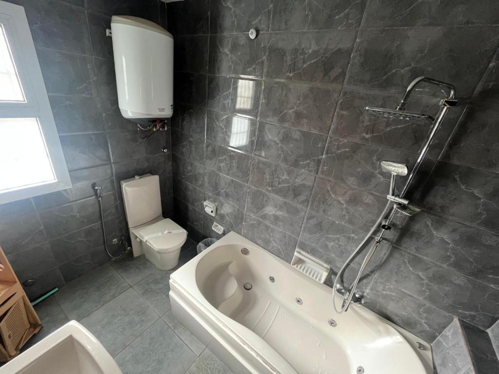Koupelna v ubytování Downtown House Suites