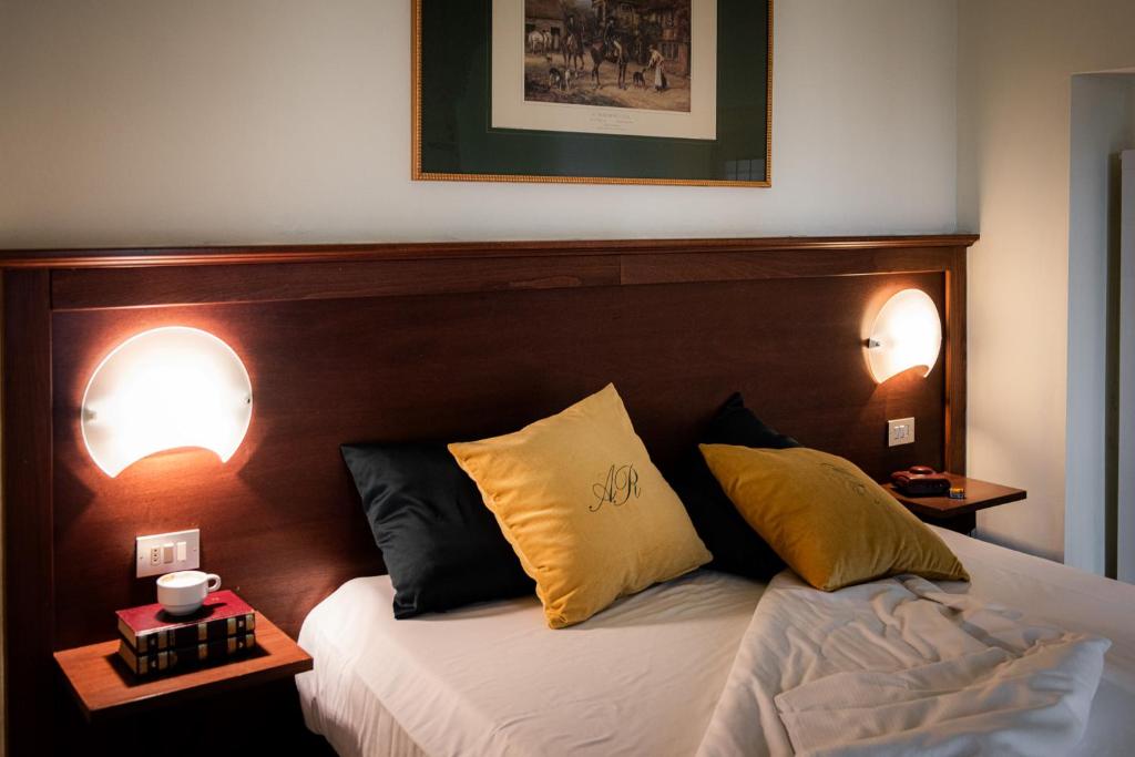 Postel nebo postele na pokoji v ubytování Albergo Reale