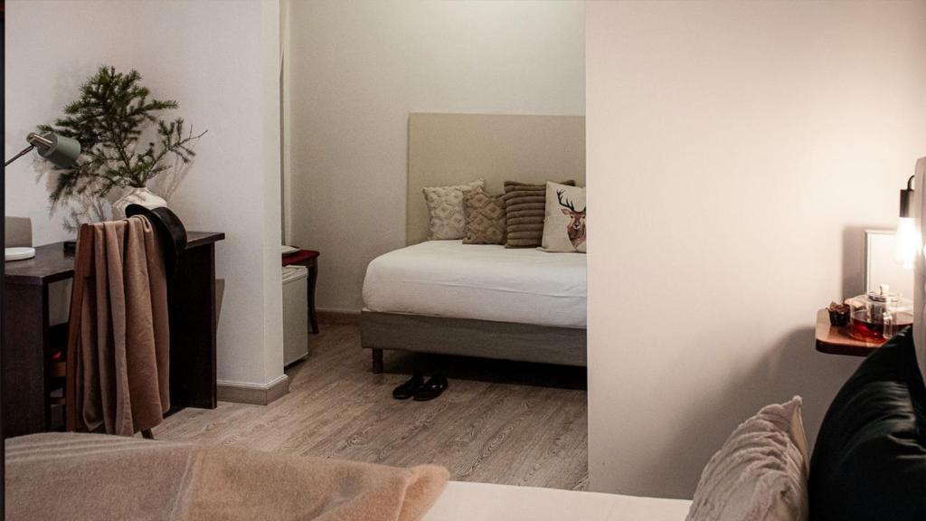 Postel nebo postele na pokoji v ubytování Albergo Reale