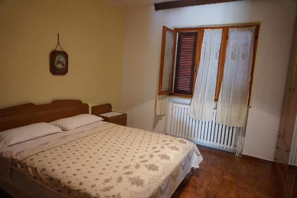 Ένα ή περισσότερα κρεβάτια σε δωμάτιο στο Ca' d' Guido