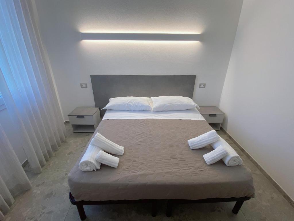 Postel nebo postele na pokoji v ubytování Hotel Residence Ponente