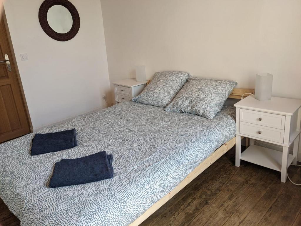 Postel nebo postele na pokoji v ubytování Gîte L'Ancienne Charcuterie