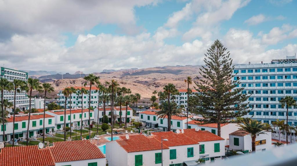 a city with palm trees and a large building at Labranda Marieta & Spa - Adults Only in Playa del Ingles