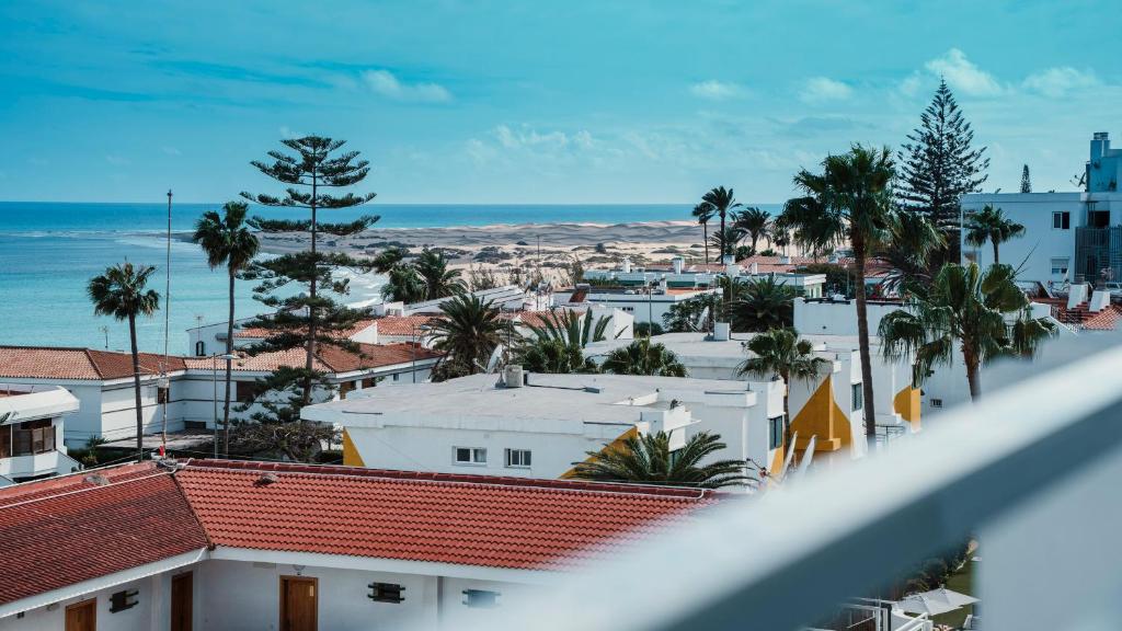 a view of a city with palm trees and the ocean at Labranda Marieta & Spa - Adults Only in Playa del Ingles