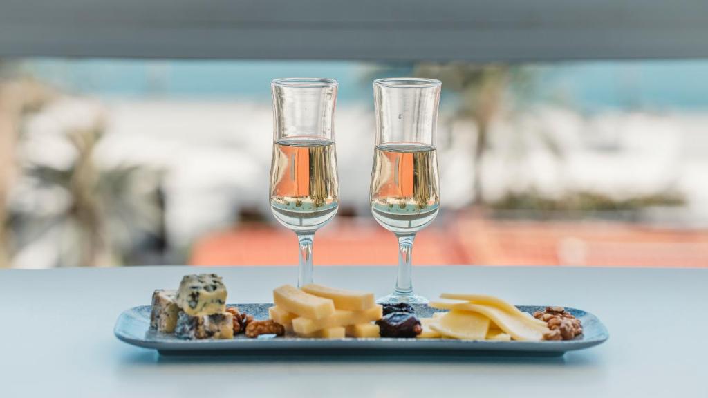 two glasses of champagne and a plate of cheese at Labranda Marieta & Spa - Adults Only in Playa del Ingles