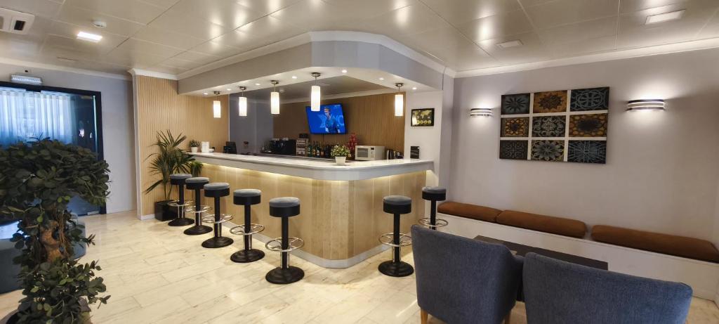 En TV eller et underholdningssystem på Hotel Sao Mamede Estoril