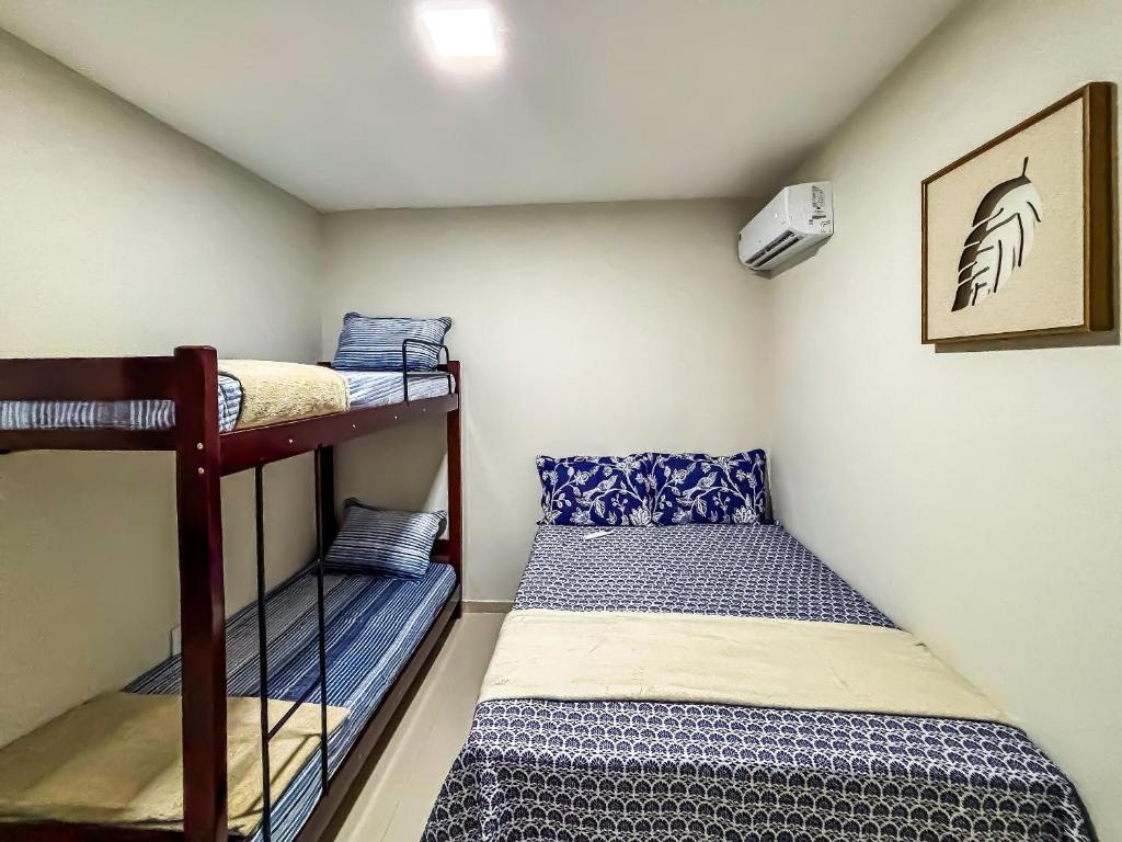 Uma cama ou camas num quarto em Vila Imper Host Balsas- Apês com Wi-fi I A/C a 3 min. do Mix Mateus