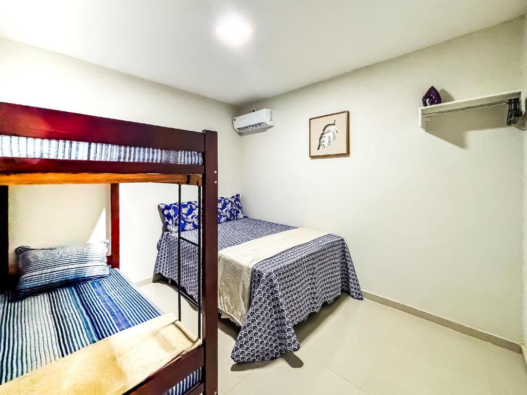 Uma cama ou camas num quarto em Vila Imper Host Balsas- Apês com Wi-fi I A/C a 3 min. do Mix Mateus