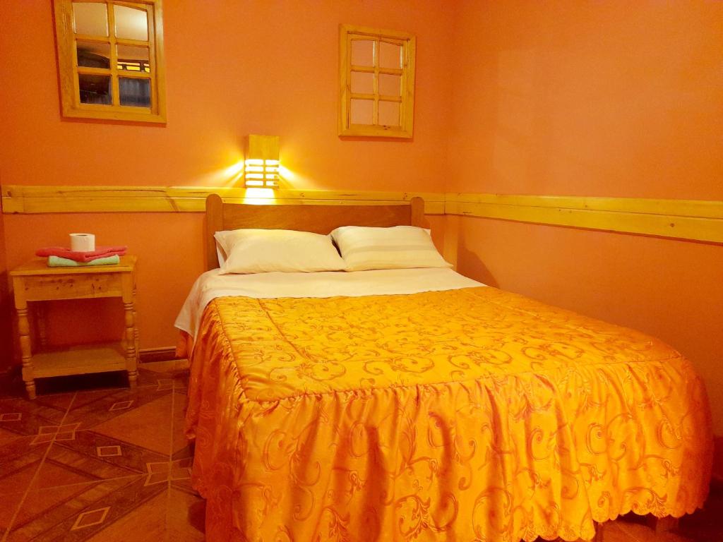 Postel nebo postele na pokoji v ubytování Jaimes Inn Hostel